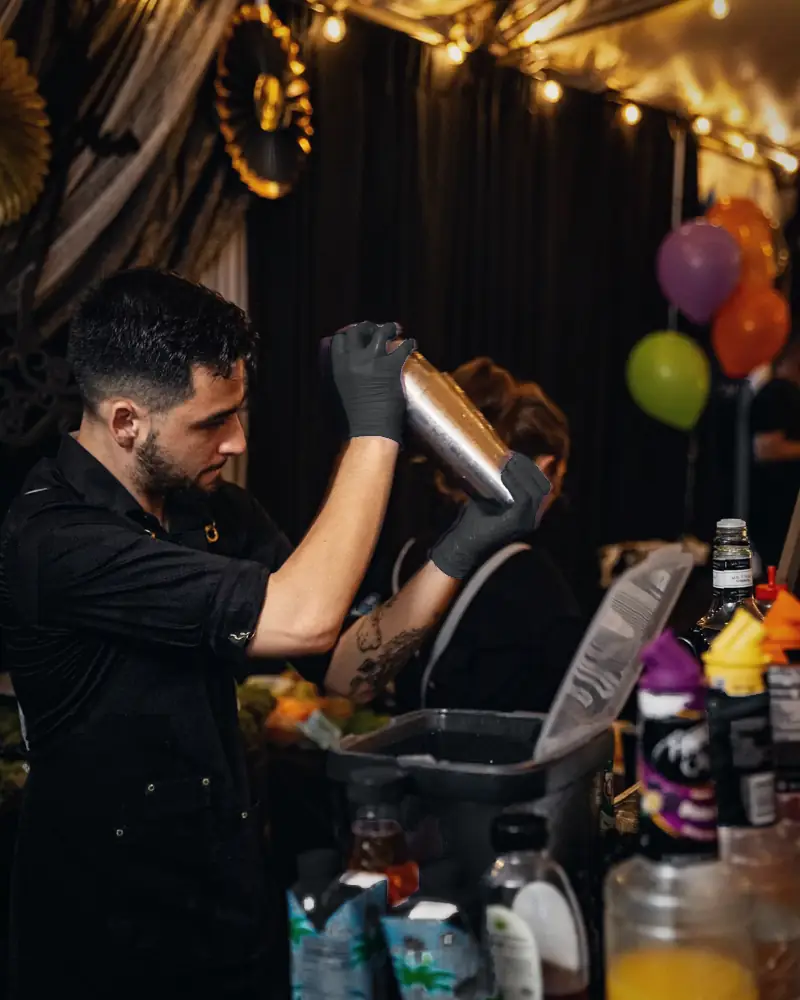 Bartender shaking a cocktail at a Halloween party