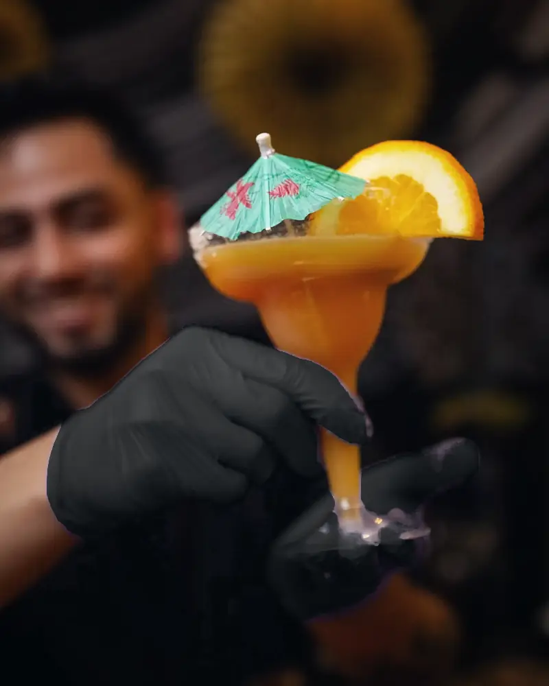 Mango margarita with an orange wheel