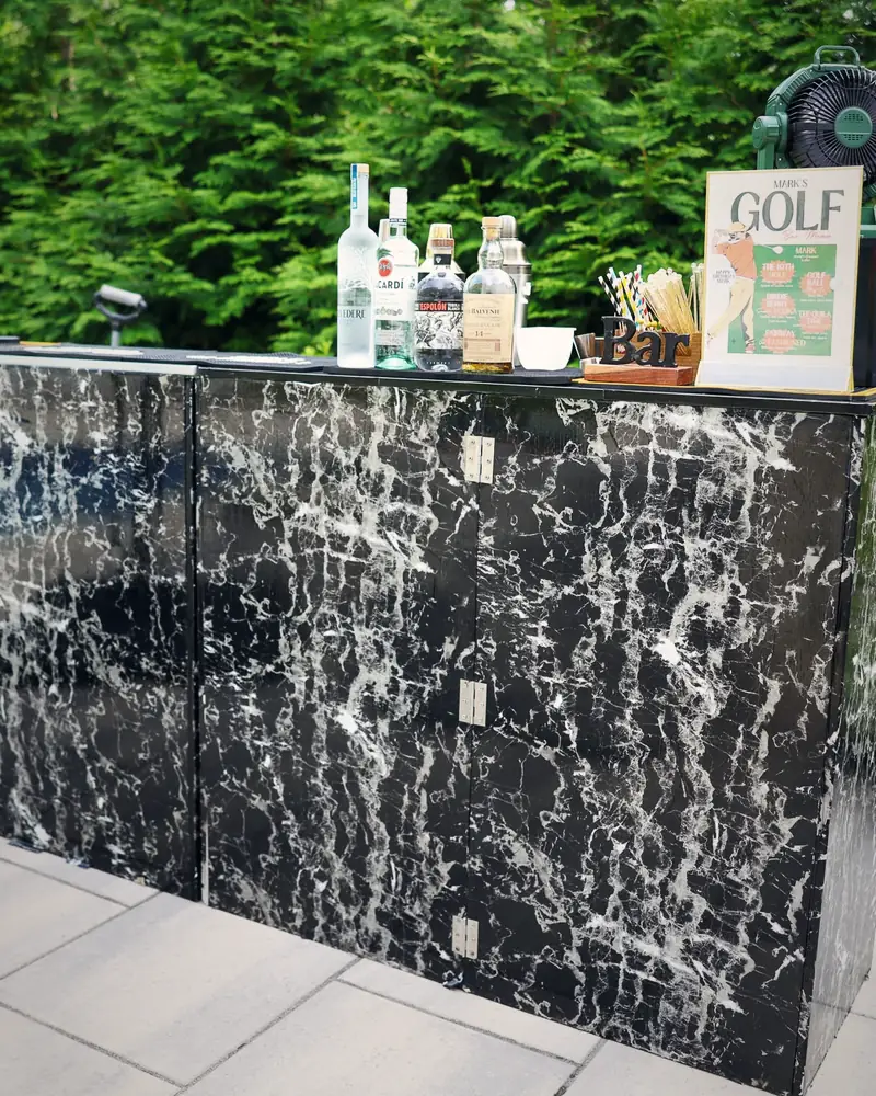 Black marble bar with a golf birthday menu