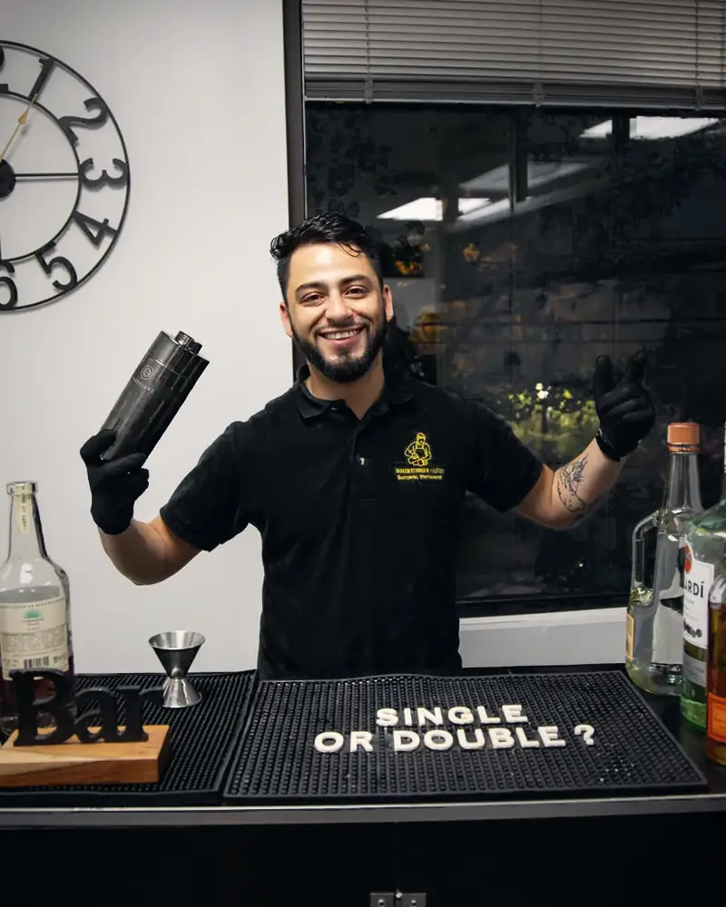 Smiling bartender at an office happy hour